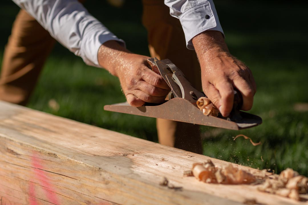 truewerk clothing branding photos of framer using a planer